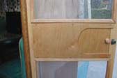 Custom made birch screen door in vintage 1955 Shasta trailer